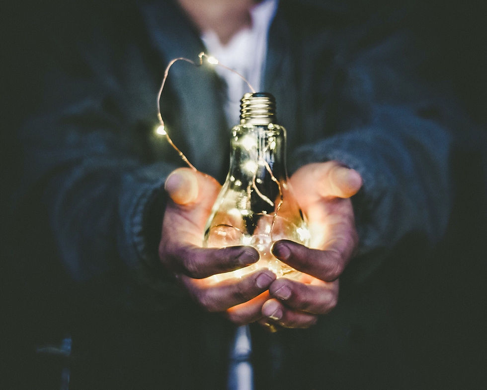 Hands on lightbulb
